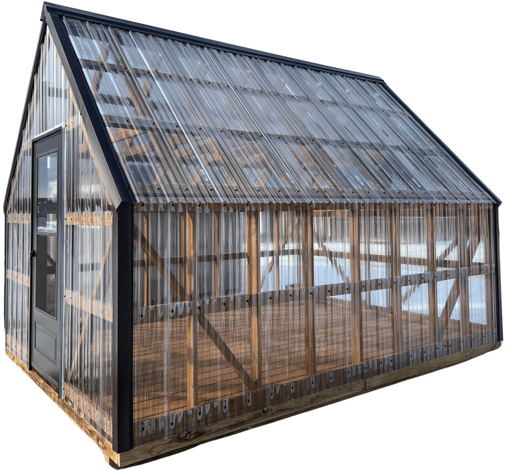 A greenhouse with a wooden frame, transparent polycarbonate panels, and a black-framed door, designed with a gable roof for maximum light exposure.